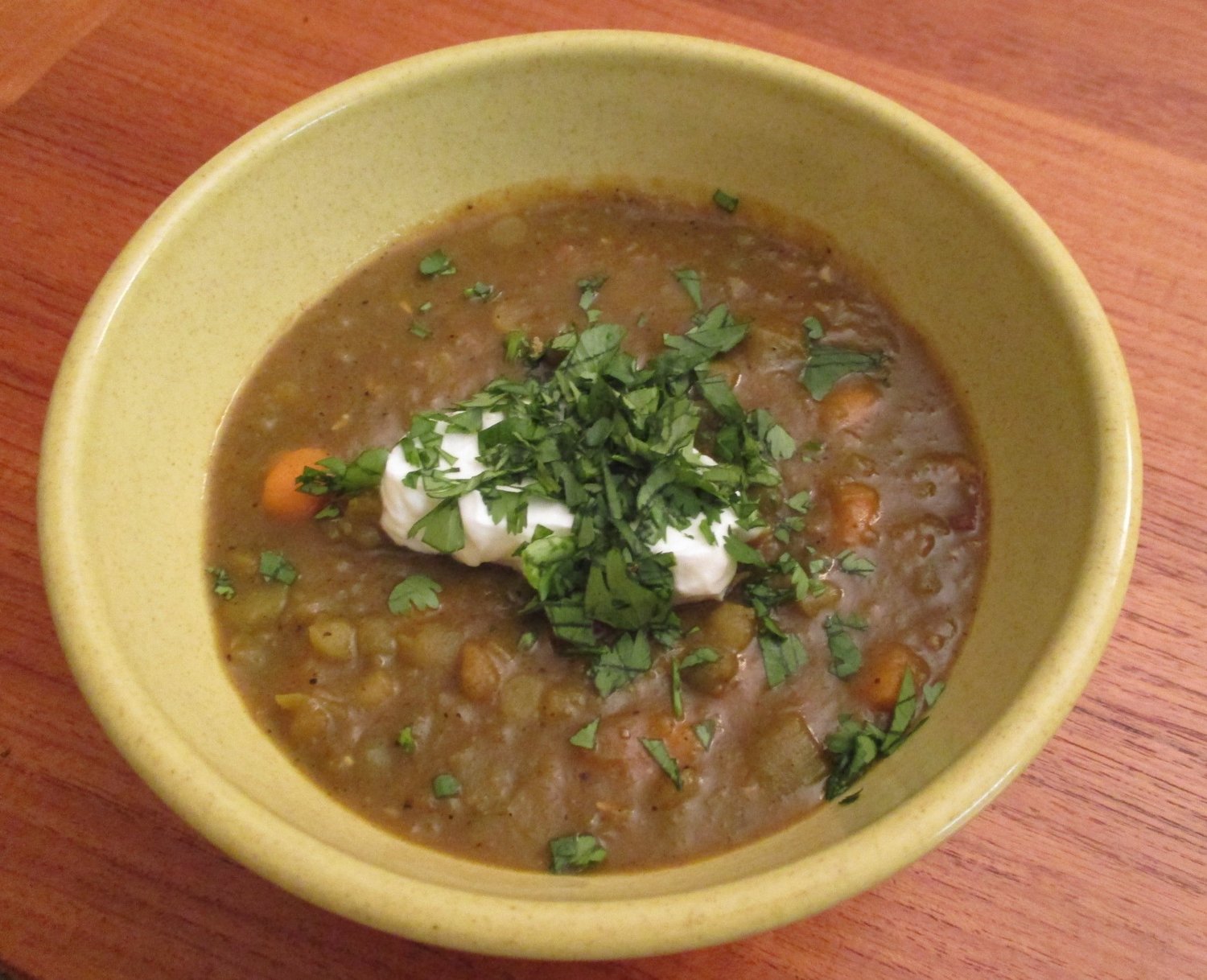 Curried split pea soup with a dollop of yogurt and cilantro garnish.